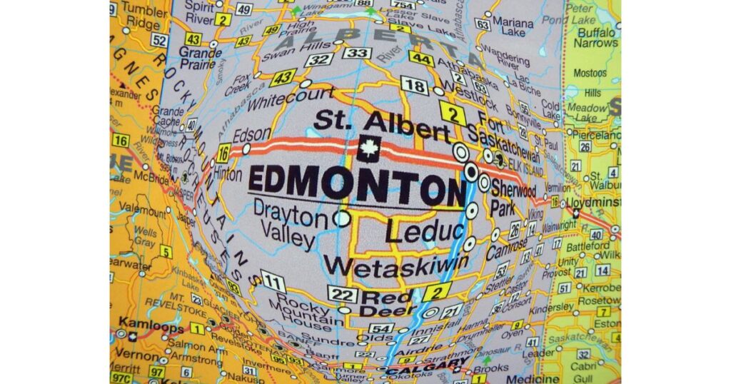 A close-up of a map focusing on Edmonton and surrounding areas, with a distorted effect highlighting the city’s location.