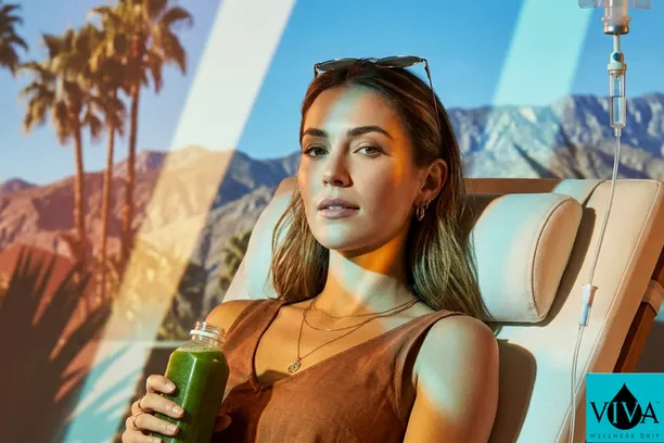 A festival-goer enjoying a Palm Desert IV drip by a luxury pool during Coachella weekend.