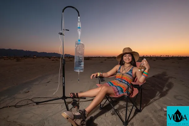 Viva Wellness nurse preparing IV drip therapy for a Coachella attendee at a Thousand Palms property