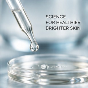 Serum dropper releasing a drop into a glass dish